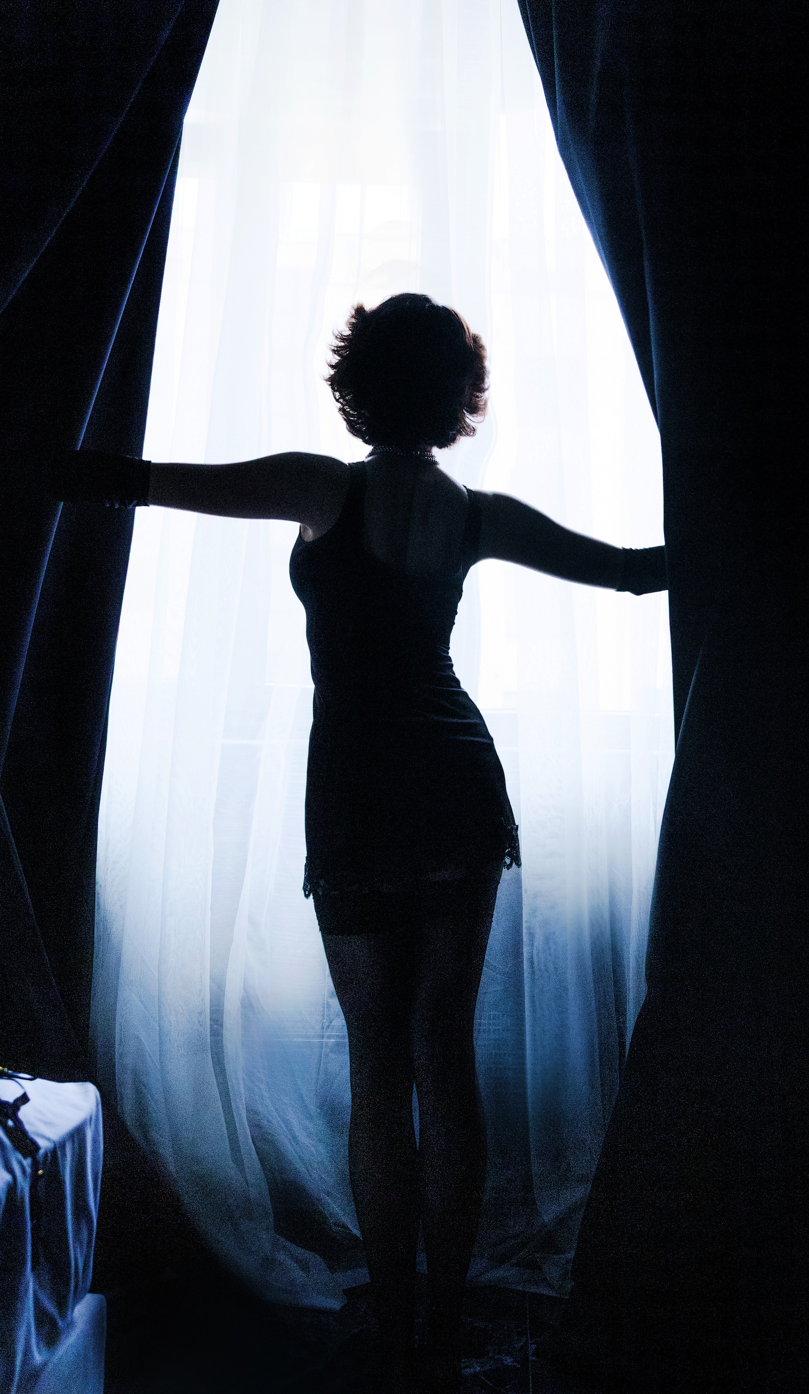 Amelie standing in front of a window
